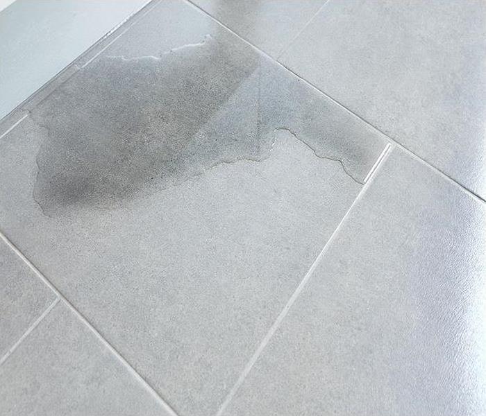 water covering tile flooring